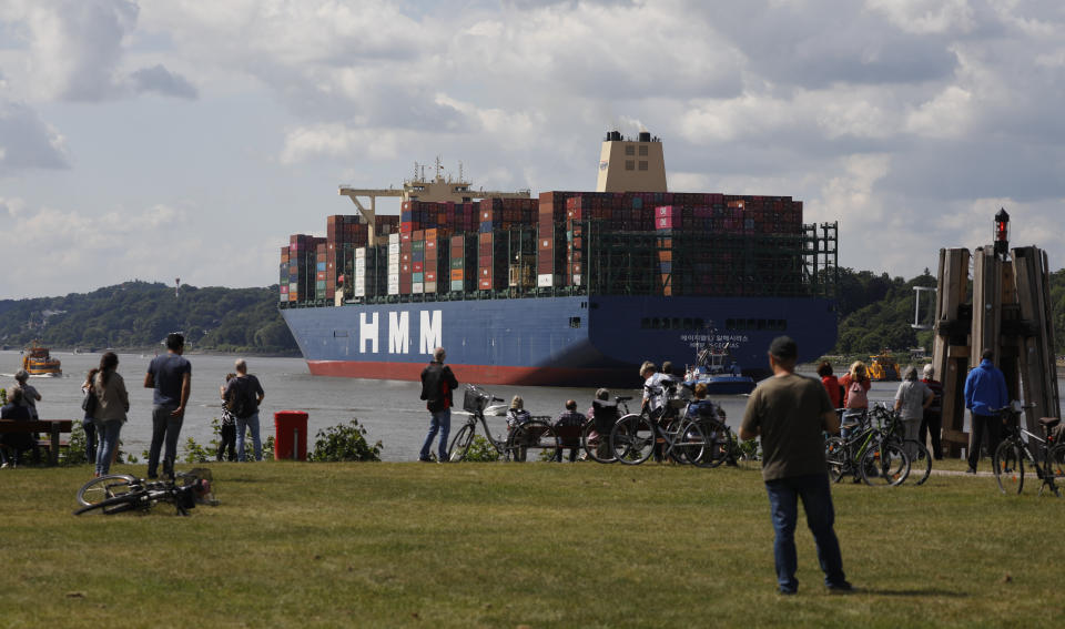 People gather to watch the ship departing from Hamburg Port.