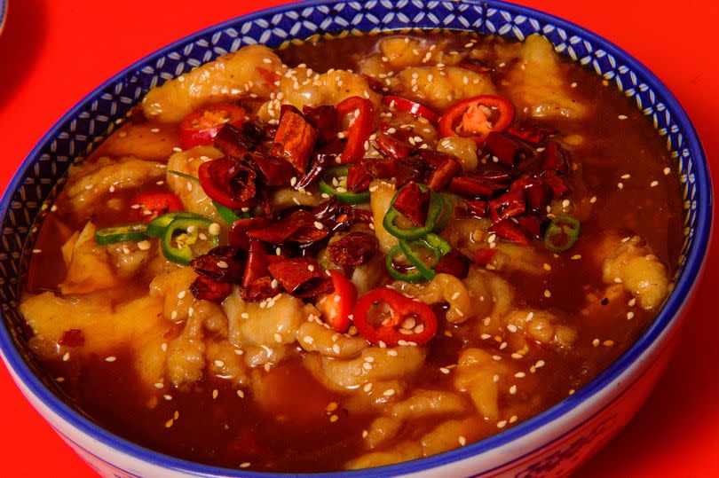 Fish in spicy soup with vegetables -Credit:Mark Lewis