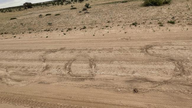 The couple wrote a giant SOS in the dirt. Source: Royal Flying Doctor Service