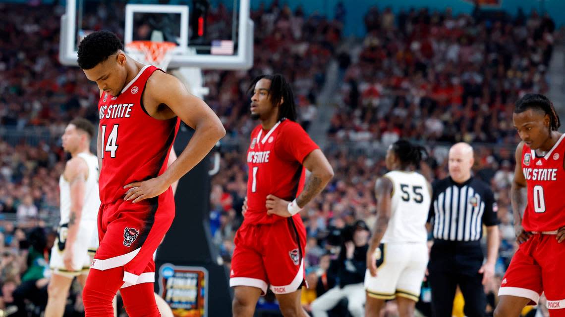 NC State’s and Casey Morsell (14), Jayden Taylor (1) and DJ Horne (0) walk to the bench during a second half timeout as they face Purdue in the Final Four, Saturday night, April 6, 2024. Ethan Hyman/ehyman@newsobserver.com