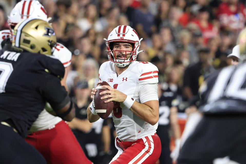 WEST LAFAYETTE, INDIANA – SEPTEMBER 22: Tanner Mordecai #8 of the Wisconsin Badgers looks to pass during the first half in the game against the <a class="link " href="https://sports.yahoo.com/ncaaw/teams/purdue/" data-i13n="sec:content-canvas;subsec:anchor_text;elm:context_link" data-ylk="slk:Purdue Boilermakers;sec:content-canvas;subsec:anchor_text;elm:context_link;itc:0">Purdue Boilermakers</a> at Ross-Ade Stadium on September 22, 2023 in West Lafayette, Indiana. (Photo by Justin Casterline/Getty Images)