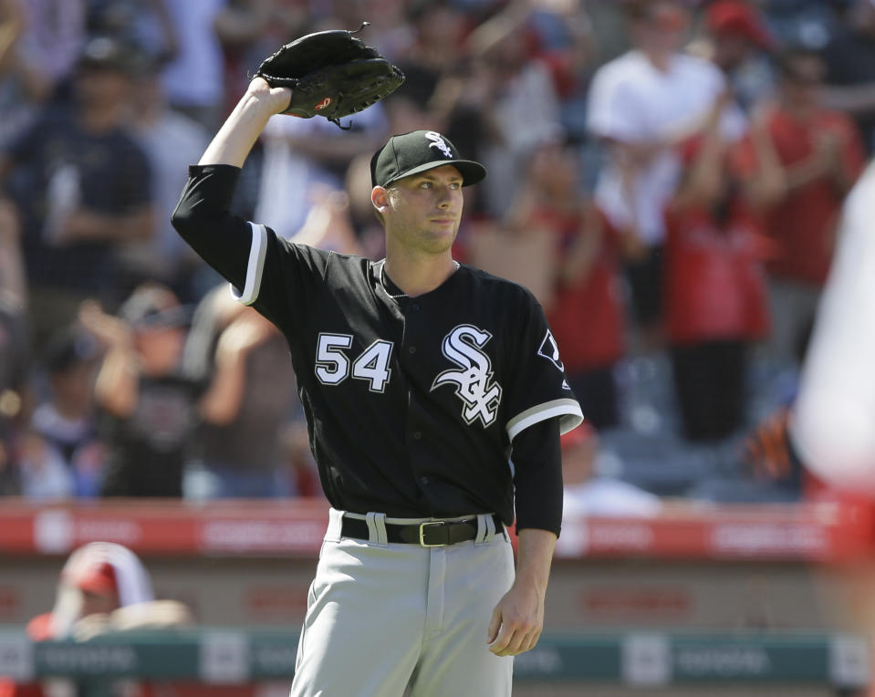 Chicago White Sox relief pitcher Ross Detwiler reacts as Los Angeles Angels designated hitter Shohei Ohtani rounds the bases after hitting a two-run home run during the seventh inning of a baseball game in Anaheim, Calif., Sunday, Aug. 18, 2019. (AP Photo/Alex Gallardo)