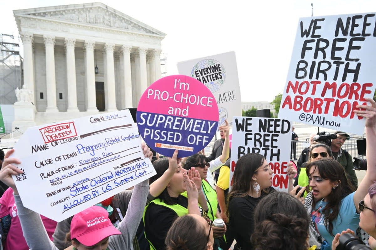 Reproductive rights activists outside of the Supreme Court at justices debate a near-total ban on abortion in Idaho (AFP via Getty Images)