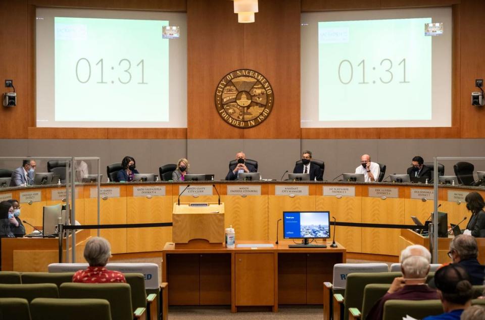 Mayor Darrell Steinberg, center, city council members and staff listen to public comment over Zoom during the Sacramento City Council meeting Tuesday the first meeting back open to public attendance at City Hall since the beginning of the COVID-19 pandemic.