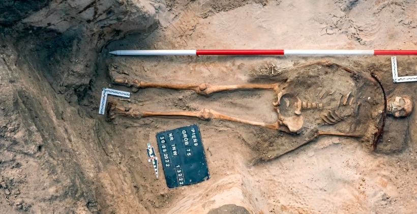 Remains of a female 'vampire' with a sickle across her throat are seen after they were unearthed at an archaeological site in a 17th-century cemetery in Bydgoszcz, Poland in August 2022.