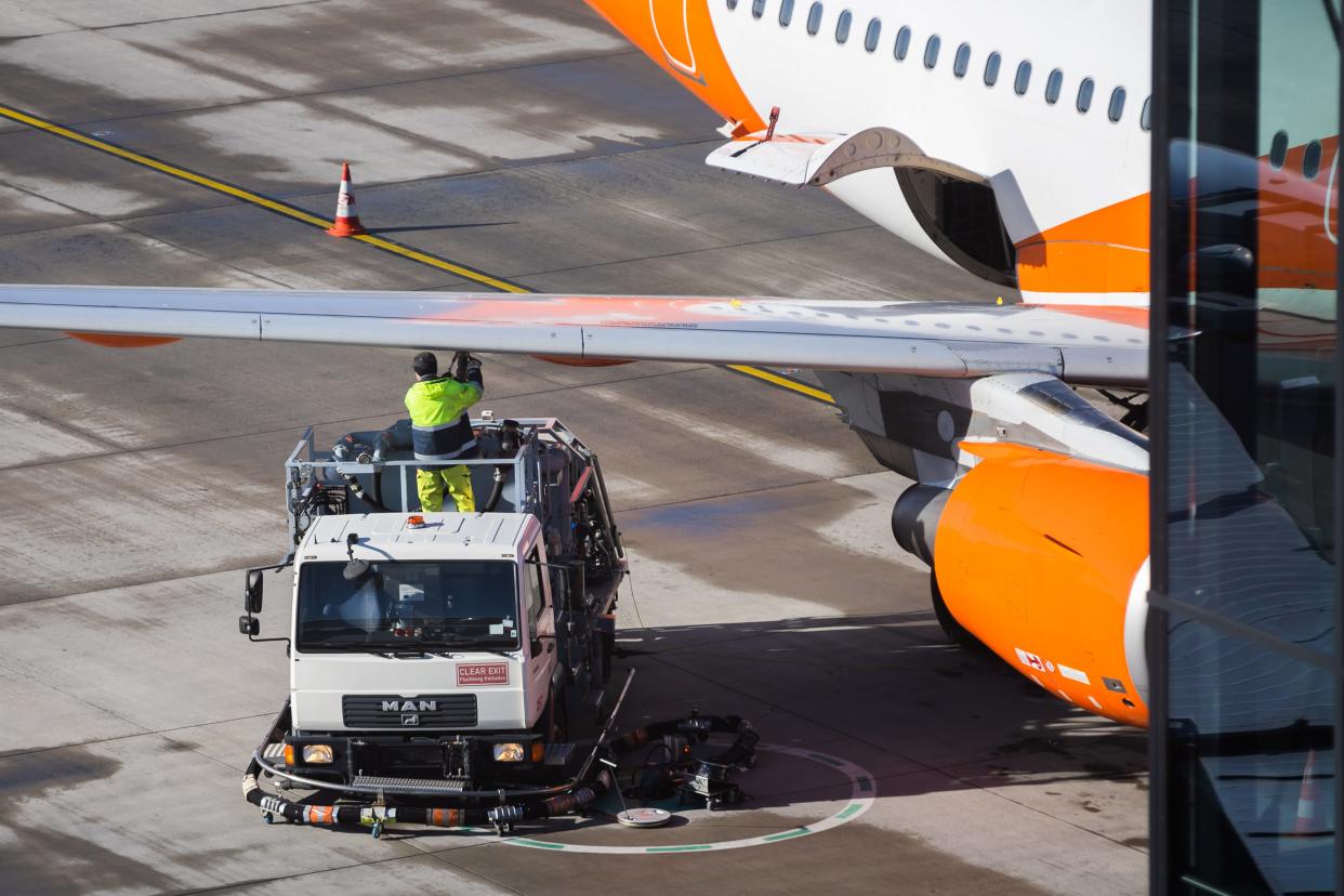 An aircraft is refueled at Berlin Brandenburg Airport (BER) "Willy Brandt" on the last weekend of the fall vacations.