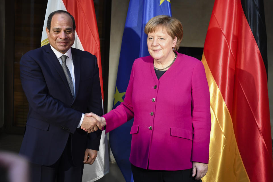 German Chancellor Angela Merkel, right, welcomes the President of Egypt Abdel Fattah al-Sisi, left, for a bilateral meeting during the Munich Security Conference in Munich, Germany, Saturday, Feb. 16, 2019. (AP Photo/Kerstin Joensson)