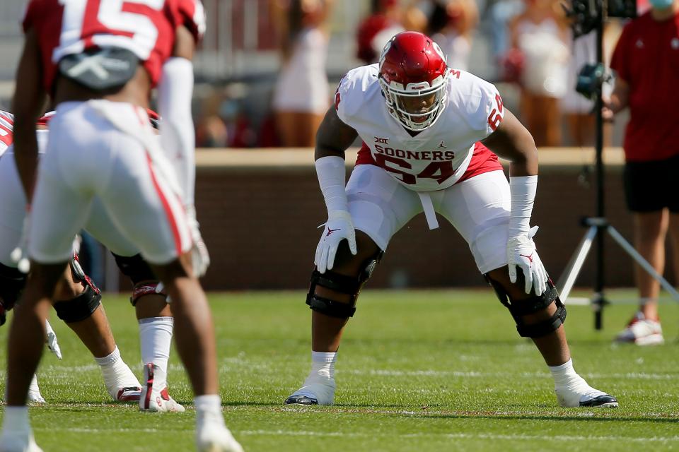 Oklahoma's Wanya Morris (64) lines up during a spring football game for the University of Oklahoma Sooners (OU) at Gaylord Family-Oklahoma Memorial Stadium in Norman, Okla., Saturday, April 24, 2021.