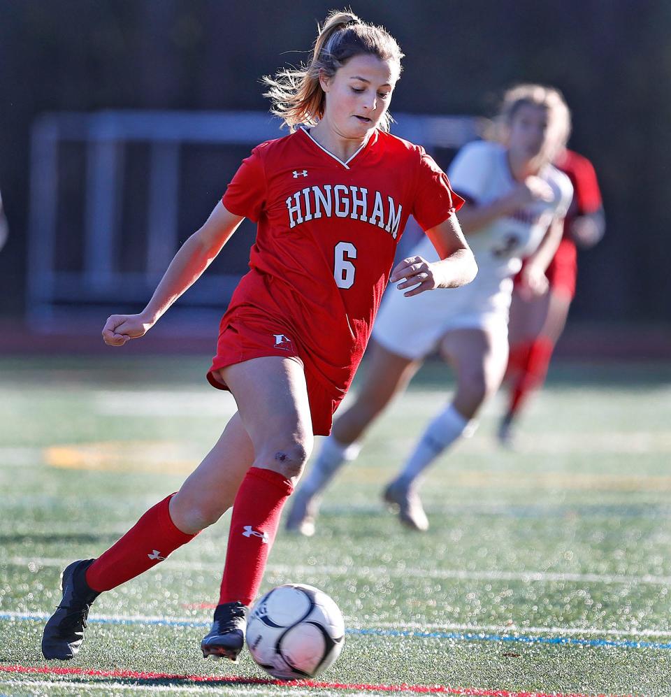 Hingham's Maddie Aughe clears the ball out of the Harborwomen's end.