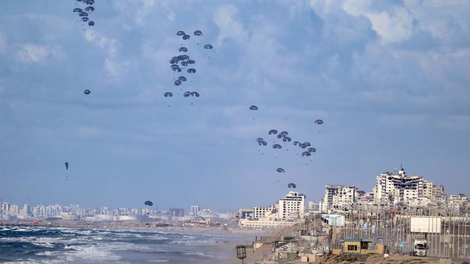 PHOTO: Humanitarian aid is air-dropped by US aircraft over the northern Gaza Strip, March 7, 2024. (Mohammed Saber/EPA via Shutterstock)