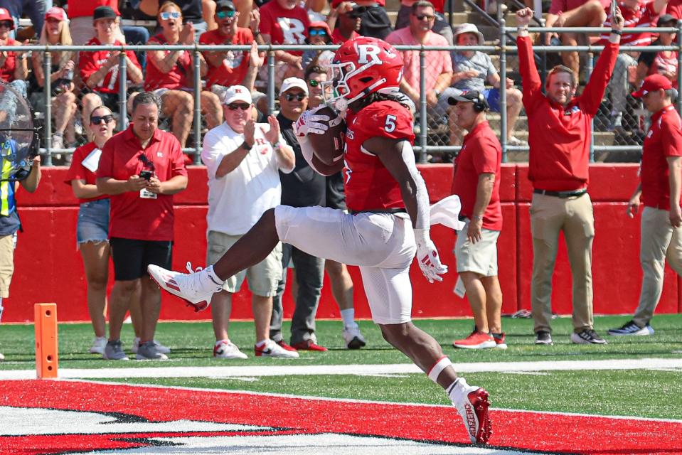 Sep 3, 2023; Piscataway, New Jersey, USA; Rutgers Scarlet Knights running back Kyle Monangai (5) scores a touchdown against the Northwestern Wildcats during the second half at SHI Stadium. Mandatory Credit: Vincent Carchietta-USA TODAY Sports