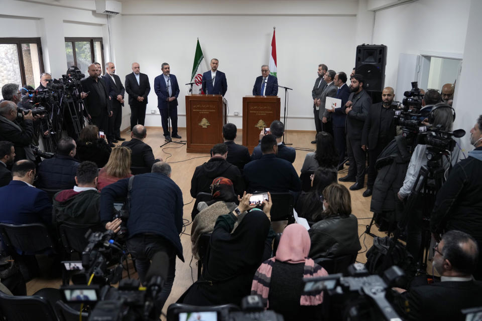 Iranian Foreign Minister Hossein Amirabdollahian, center left, speaks to journalists during a joint press conference with his Lebanese counterpart Abdallah Bouhabib, center right, in Beirut, Lebanon, Friday, Jan. 13, 2023. Amirabdollahian said talks between regional rivals Iran and Saudi Arabia are continuing and could eventually restore diplomatic relations that were severed years ago. (AP Photo/Bilal Hussein)