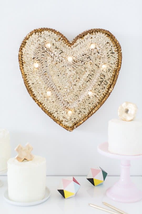 <p>If you really want to make a statement with your DIY Valentine's Day decor, opt for a sequined marquee heart. </p><p>Get the tutorial at <a href="https://sugarandcloth.com/diy-sequin-marquee-heart/" rel="nofollow noopener" target="_blank" data-ylk="slk:Sugar and Cloth;elm:context_link;itc:0;sec:content-canvas" class="link ">Sugar and Cloth</a>.</p>