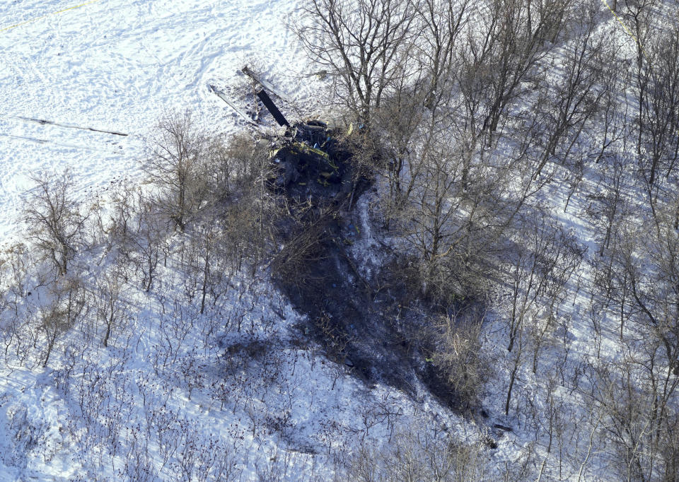 This aerial photo shows the crash site of a Minnesota National Guard Blackhawk helicopter, Friday Dec. 6, 2019, near Kimball, Minn. Three soldiers were killed in Thursday's crash at the edge of a farm field about 30 miles south of St. Cloud. (Brian Peterson/Star Tribune via AP)