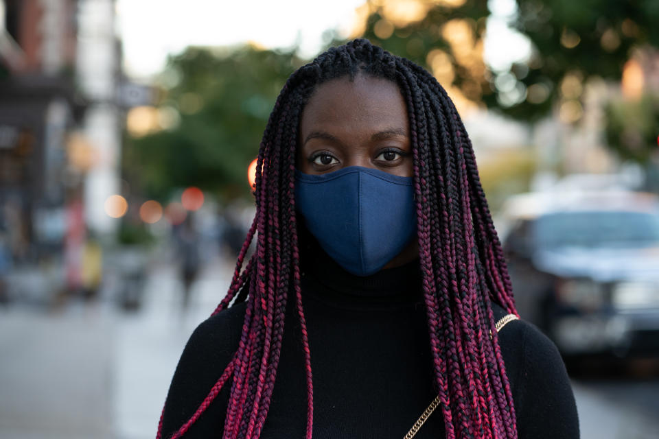 NEW YORK, NEW YORK - OCTOBER 15: Woman wears a navy blue face mask and a black long sleeve shirt in Soho on October 15, 2020 in New York City. (Photo by Jared Siskin/Getty Images)