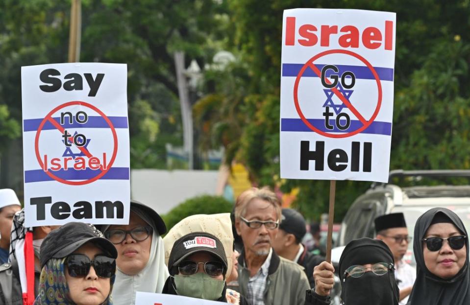 Indonesians protest against Israel's participation in the Under-20 World Cup in Jakarta on March 20, 2023.<span class="copyright">Adek Berry—AFP/Getty Images</span>