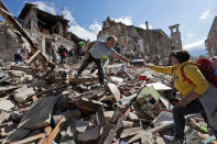 <p>Rescuers search for survivors under the rubble of the town of Amatrice, central Italy, Wednesday, Aug. 24, 2016 following an earthquake. (AP Photo/Alessandra Tarantino) </p>