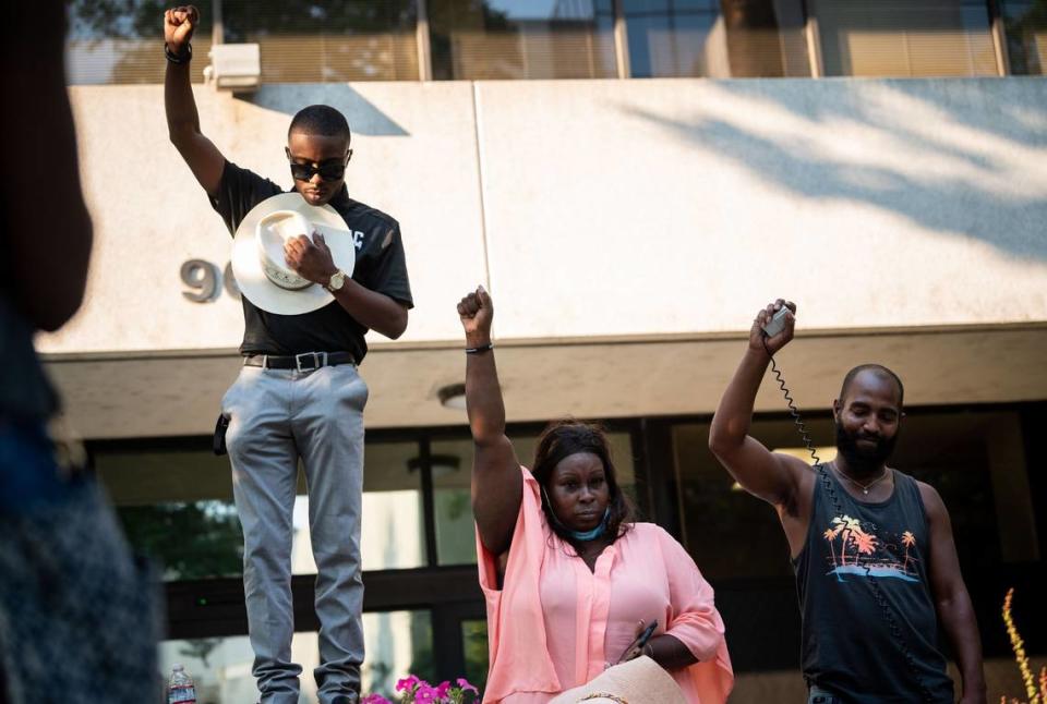 Se’Quette Clark, center, mother of Stephon Clark, who was killed by Sacramento police in 2018, stands next to her other son and activist Stevante Clark during a moment of silence in solidarity with the family of Jacob Blake during the Justice for Jake event outside the Sacramento County District Attorney’s Office on Wednesday, Aug. 26, 2020, in downtown Sacramento. 