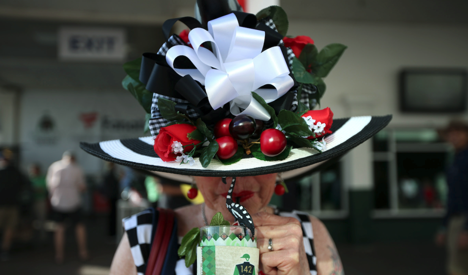 A woman enjoys a mint julep before the 142nd running of the Kentucky Derby at Churchill Downs in 2016. (Photo: Kramer Caswell/Louisville Courier-Journal via USA TODAY)