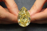 This 110.03 carat sun-drop diamond sold in 2011 in London, England. The diamond is the largest yellow pear-shaped diamond in the world, and sold for 11,282,500 (nearly $12M USD) (Photo by Dan Kitwood/Getty Images)