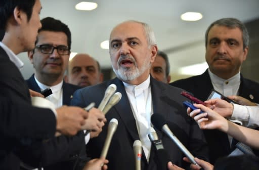 Iranian Foreign Minister Mohammad Javad Zarif (C) says Tehran is exercising "maximum restraint"