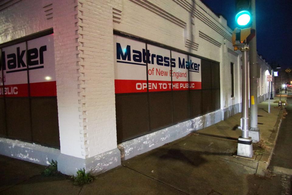 For 14 years, Brockton City Councilor-at-large David Teixeira has owned this mattress store on the corner of School and Montello streets in downtown Brockton, adjacent to the School Street MBTA Commuter Rail bridge, seen here on Nov. 30, 2023. He is considering moving due to drug use and other issues near the store.