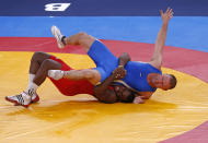 Cuba's Mijain Lopez Nunez (in red) fights with Estonia's Heiki Nabi on the final of the Men's 120Kg Greco-Roman wrestling at the ExCel venue during the London 2012 Olympic Games August 6, 2012. REUTERS/Kim Kyung-Hoon (BRITAIN - Tags: OLYMPICS SPORT WRESTLING) 