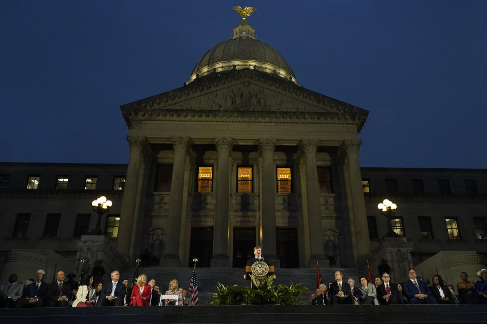 FILE - Mississippi Gov. Tate Reeves, center, speaks during his State of the State address on the steps of the state Capitol in Jackson, Miss., Monday, Jan. 30, 2023. The capital city has had Black mayors since 1997. Reeves has campaigned in the past on withholding state financial support the city requested. During the 2022 water crisis, Reeves said in another city that it was “as always, a great day to not be in Jackson.” (AP Photo/Rogelio V. Solis, File)