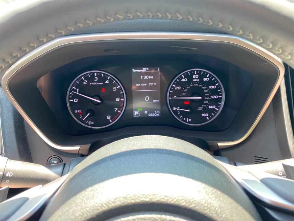 Subaru Ascent's instrument cluster features two large analog dials flanking a central digital information display.