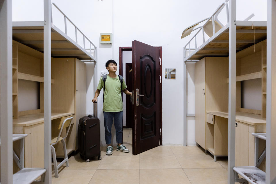 College students report to their dormitories