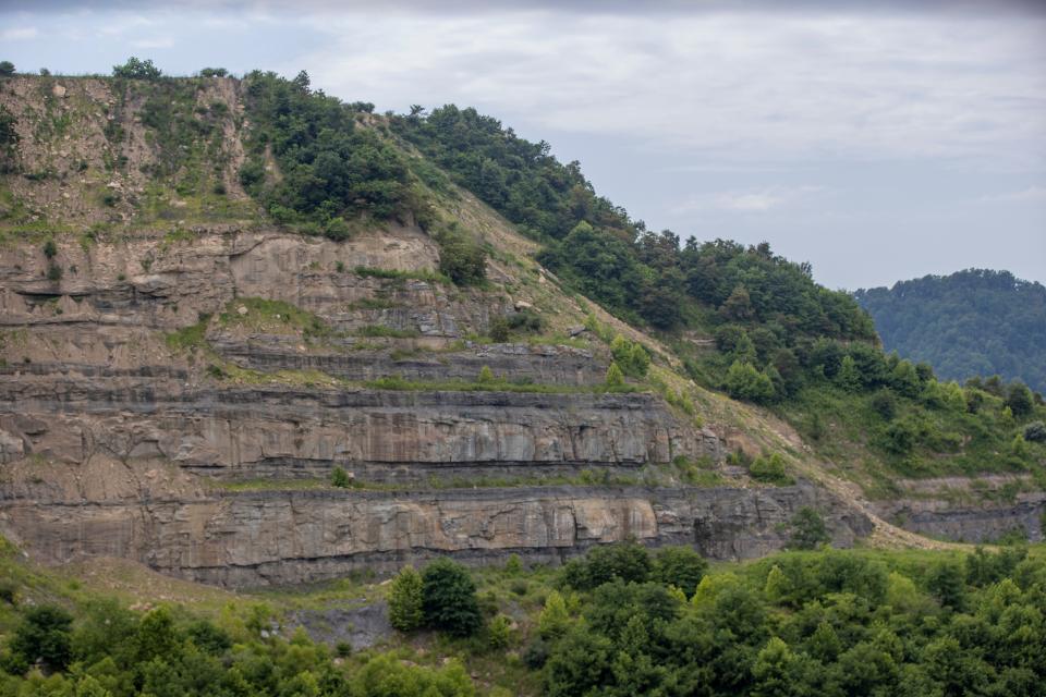 A close view of a high wall over a few hundred feet tall on the strip mined property of the Neece family in Floyd County, Kentucky. July 15, 2021