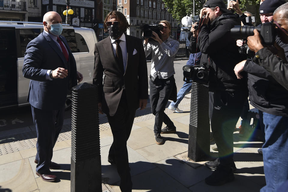 Johnny Depp arrives at the High Court in London, Friday July 10, 2020. Depp is back in the witness box at the trial of his libel suit against a tabloid newspaper that called him a "wife-beater" in an April 2018 article that said he'd physically abused ex-wife Amber Heard. Depp strongly denies the allegations. (AP Photo/Alberto Pezzali)