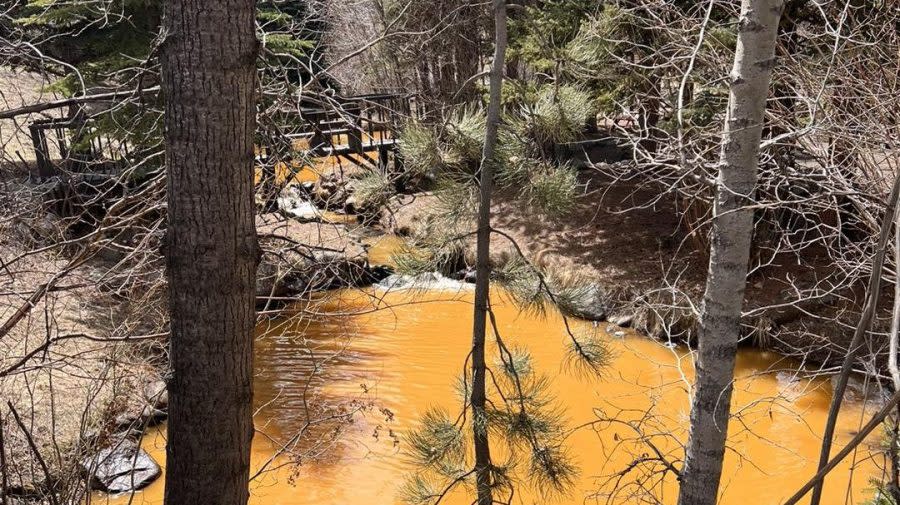 Discolored water in Clear Creek on April 23, 2024. The sheriff's department said Environmental Health is investigating.