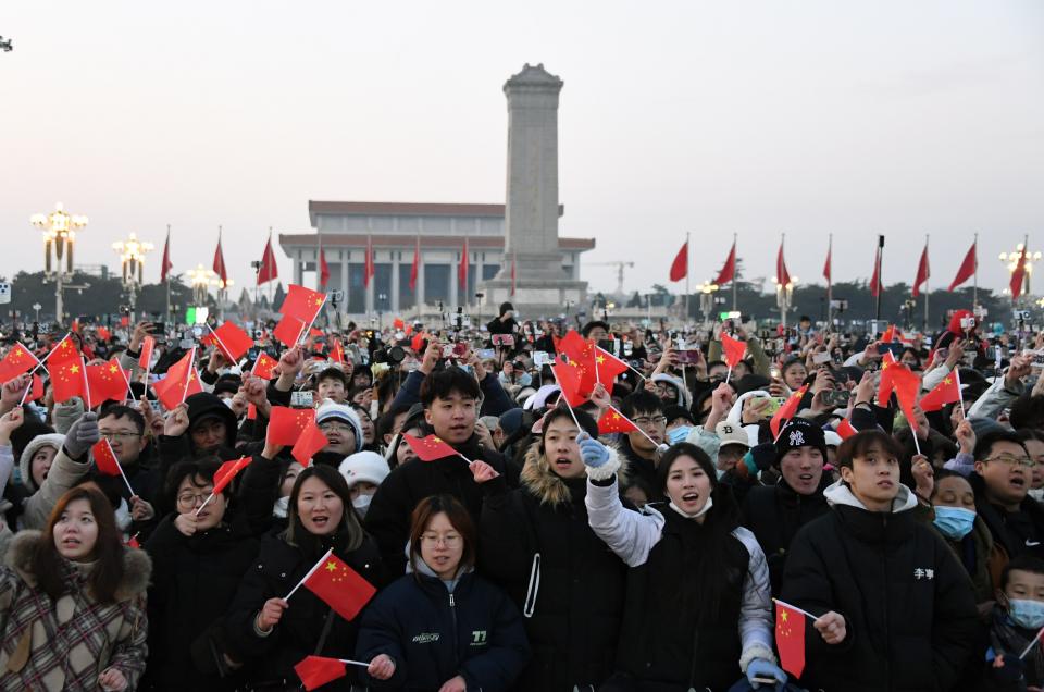 People hail after a grand national flag-raising ceremony at the Tian'anmen Square in Beijing, capital of China, Jan. 1, 2024. (Photo by Ren Chao/Xinhua via Getty Images)