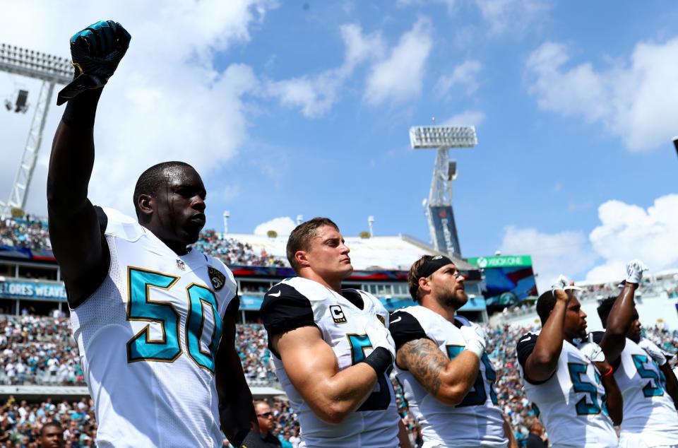 <p>Telvin Smith #50 of the Jacksonville Jaguars raises his arm in protest with teammates during the National Anthem prior to the game against the Baltimore Ravens at EverBank Field on September 25, 2016 in Jacksonville, Florida. (Photo by Maddie Meyer/Getty Images) </p>