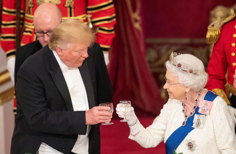 Then-President Donald Trump, left and Queen Elizabeth II toast, during the State Banquet at Buckingham Palace, in London, June 3, 2019.