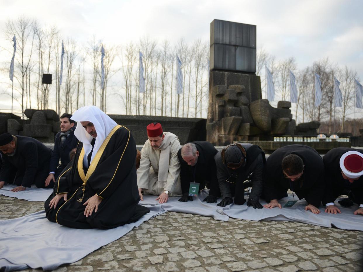 Muslim faith leaders perform Islamic prayers during a visit to Auschwitz: Getty