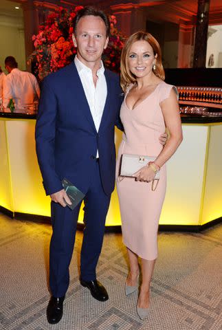 <p>David M. Benett/Getty</p> Christian Horner and Geri Halliwell attend The F1 Party in aid of the Great Ormond Street Children's Hospital at the Victoria and Albert Museum on July 2, 2014 in London, England