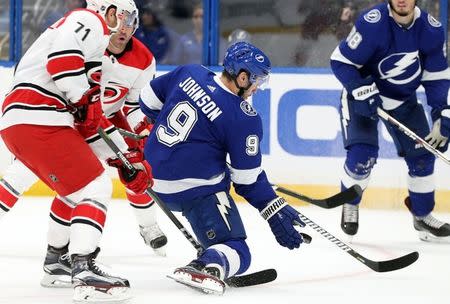 Oct 16, 2018; Tampa, FL, USA; Tampa Bay Lightning center Tyler Johnson (9) defends the puck during the first period at Amalie Arena. Mandatory Credit: Kim Klement-USA TODAY Sports