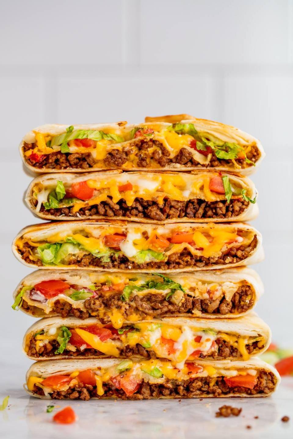 <p>Taco Bell's Crunchwrap Supreme is the stuff of legends, and we totally see why: Full of seasoned <a href="https://www.delish.com/cooking/g1703/ground-beef-dishes/" rel="nofollow noopener" target="_blank" data-ylk="slk:ground beef;elm:context_link;itc:0;sec:content-canvas" class="link ">ground beef</a>, <a href="https://www.delish.com/cooking/recipe-ideas/a25862033/nacho-cheese-sauce-recipe/" rel="nofollow noopener" target="_blank" data-ylk="slk:nacho cheese sauce;elm:context_link;itc:0;sec:content-canvas" class="link ">nacho cheese sauce</a>, lettuce, tomatoes, sour cream, and, most importantly, a crunchy <a href="https://www.delish.com/cooking/recipe-ideas/a27168236/tostada-recipe/" rel="nofollow noopener" target="_blank" data-ylk="slk:tostada;elm:context_link;itc:0;sec:content-canvas" class="link ">tostada</a> shell, this stacked, handheld dish has just about everything you could ever want... and now you can make it at home!</p><p>Get the <strong><a href="https://www.delish.com/cooking/recipe-ideas/a52078/crunchwrap-supreme-recipe/" rel="nofollow noopener" target="_blank" data-ylk="slk:Copycat Crunchwrap Supreme recipe;elm:context_link;itc:0;sec:content-canvas" class="link ">Copycat Crunchwrap Supreme recipe</a></strong>.</p>