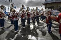 The Los Angeles Unified School District All District High School Honor Band Tuba section prepare to participate in the Kingdom Day Parade in Los Angeles, Monday, Jan. 16, 2023. After a two-year hiatus because of the COVID-19 pandemic, the parade, America's largest Martin Luther King Day celebration returned. (AP Photo/Richard Vogel)