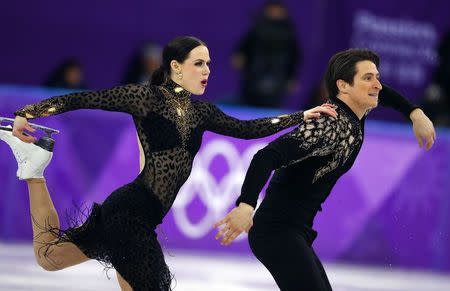 Figure Skating - Pyeongchang 2018 Winter Olympics - Ice Dance short dance competition - Gangneung Ice Arena - Gangneung, South Korea - February 19, 2018 - Tessa Virtue and Scott Moir of Canada perform. REUTERS/Phil Noble