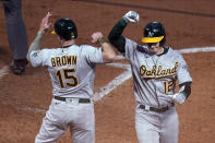 Oakland Athletics' Sean Murphy (12) is congratulated by Seth Brown on his two-run home run off Minnesota Twins pitcher Matt Shoemaker during the fifth inning of a baseball game, Friday, May 14, 2021, in Minneapolis. (AP Photo/Jim Mone)