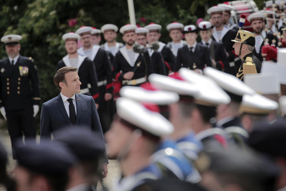 French President Emmanuel Macron reviews military troops during the ceremony of his inauguration for a second term at the Elysee palace, in Paris, France, Saturday, May 7, 2022. Macron was reelected for five years on April 24 in an election runoff that saw him won over far-right rival Marine Le Pen. (AP Photo/Lewis Joly)