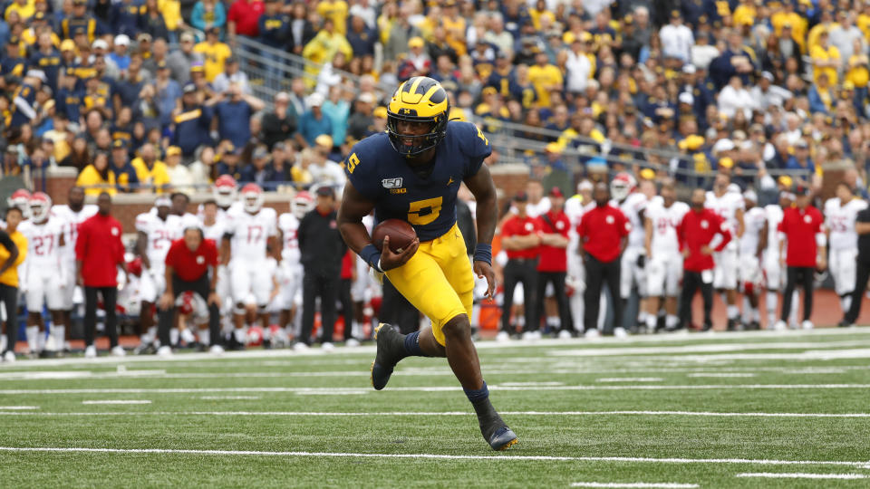 Michigan quarterback Joe Milton runs for a one-yard touchdown in the second half of an NCAA college football game against Rutgers in Ann Arbor, Mich., Saturday, Sept. 28, 2019. (AP Photo/Paul Sancya)