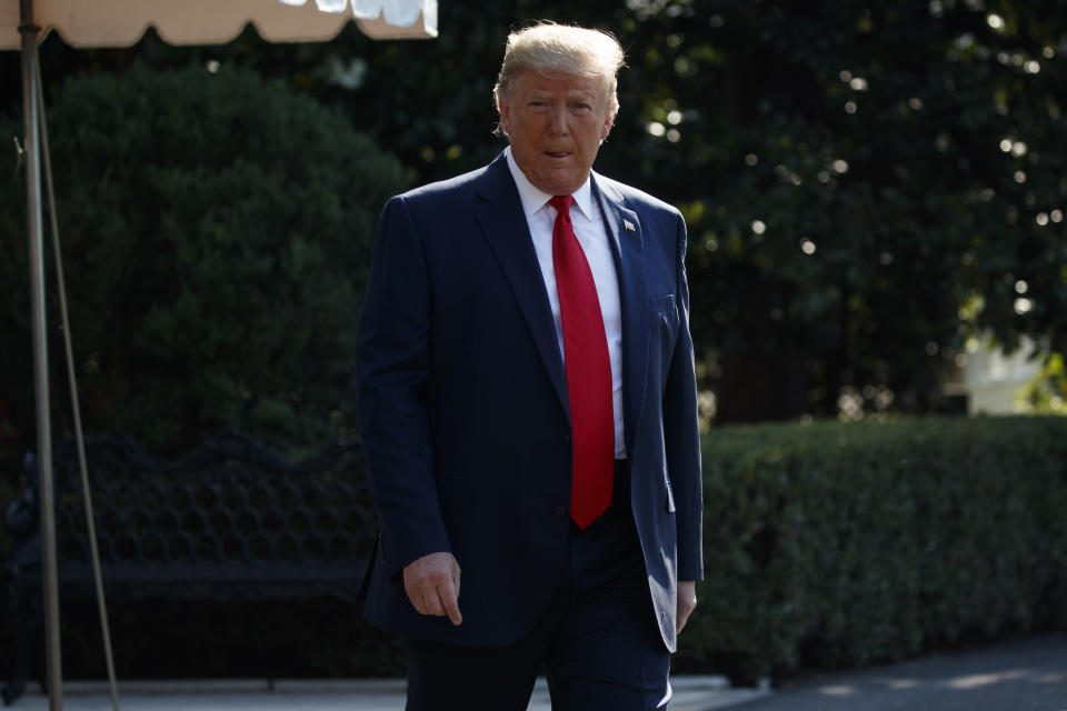 President Donald Trump walks over to speak with reporters before departing for an event to celebrate the 400th anniversary celebration of the first representative assembly at Jamestown, on the South Lawn of the White House, Tuesday, July 30, 2019, in Washington. (AP Photo/Evan Vucci)