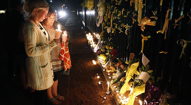 Devastated family and friends of the popular teacher paid their respects. Photo: AAP