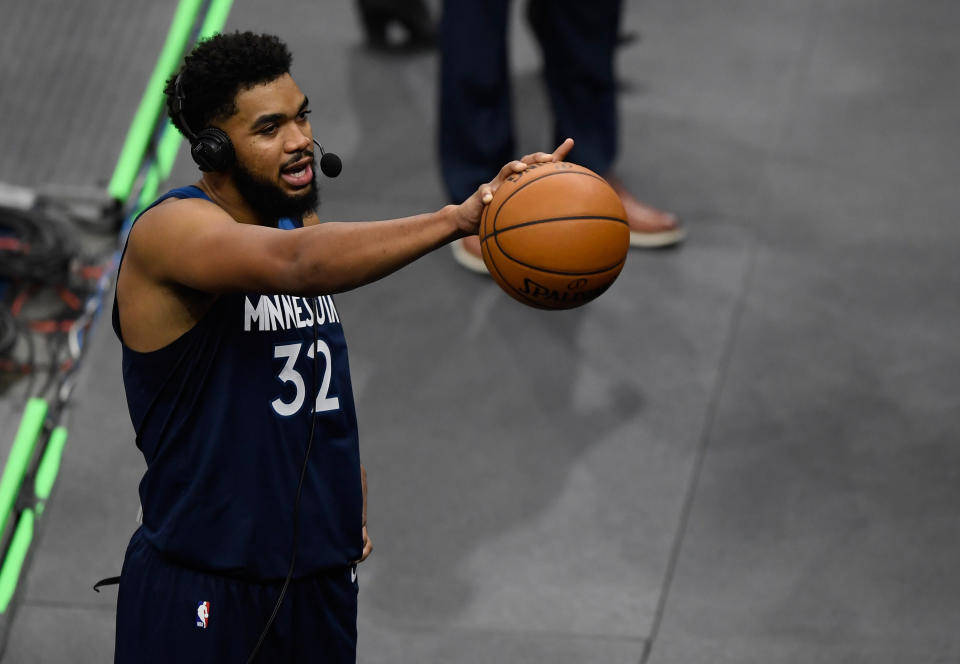 MINNEAPOLIS, MINNESOTA - DECEMBER 23: Karl-Anthony Towns #32 of the Minnesota Timberwolves wears a headset as he does an interview after the season opening game against the Detroit Pistons at Target Center on December 23, 2020 in Minneapolis, Minnesota. The Timberwolves defeated the Pistons 111-101. NOTE TO USER: User expressly acknowledges and agrees that, by downloading and or using this Photograph, user is consenting to the terms and conditions of the Getty Images License Agreement (Photo by Hannah Foslien/Getty Images)