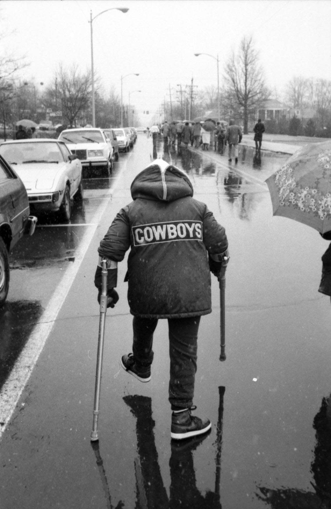 Eight-year-old Lamin Swann joined 1,200 people marching Jan. 19, 1986 in Lexington, Ky. on the eve the first national observance of Martin Luther King Jr. The 1 1/2-mile march went around the University of Kentucky campus, starting and ending at Memorial Coliseum. Swann also marched in 1987.