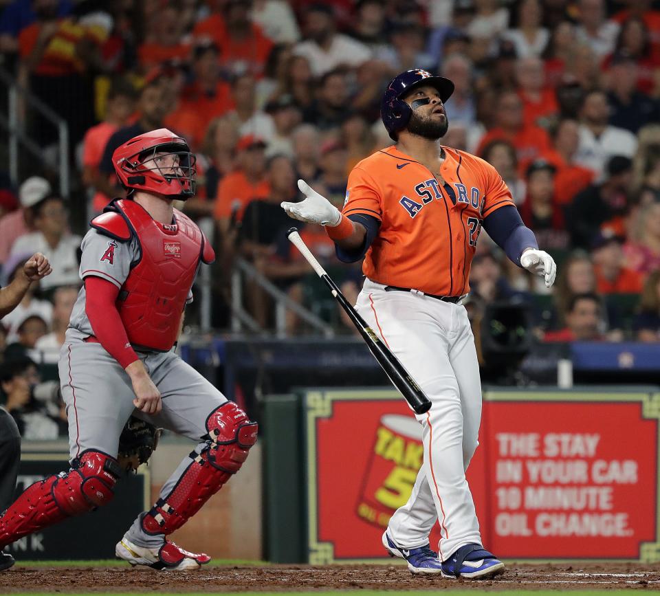 The Houston Astros' Jon Singleton hits a three-run homer in the second inning against the Los Angeles Angels at Minute Maid Park on Friday night